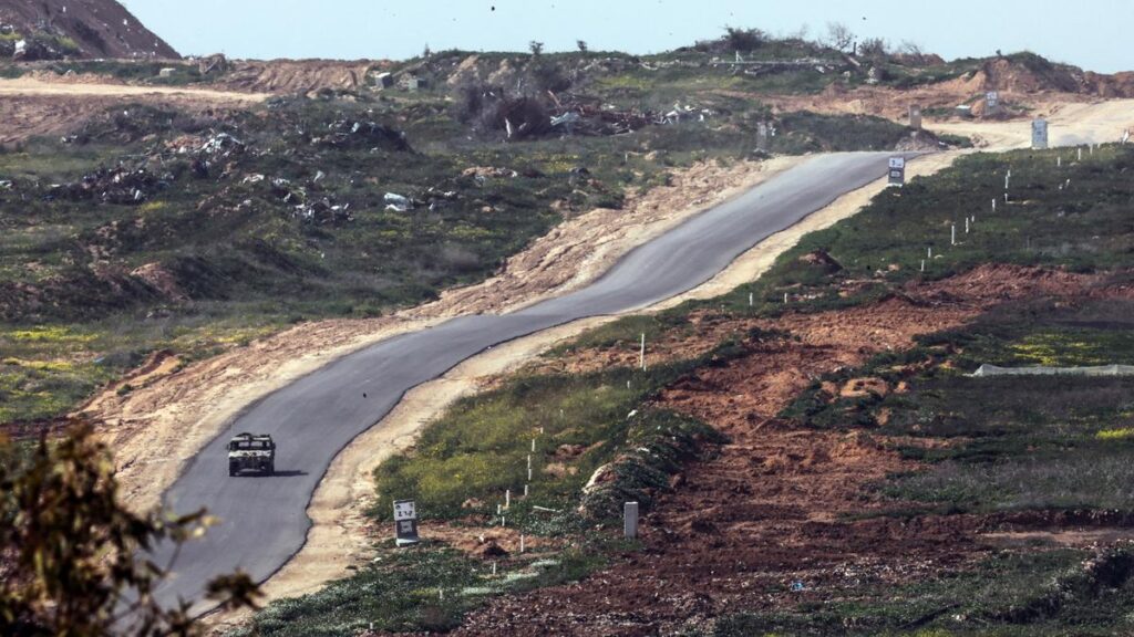 A military vehicle drives inside Gaza as seen from the Israeli side, at the the border between Israel and Gaza, on March 5, 2025. | Photo Credit: Reuters
